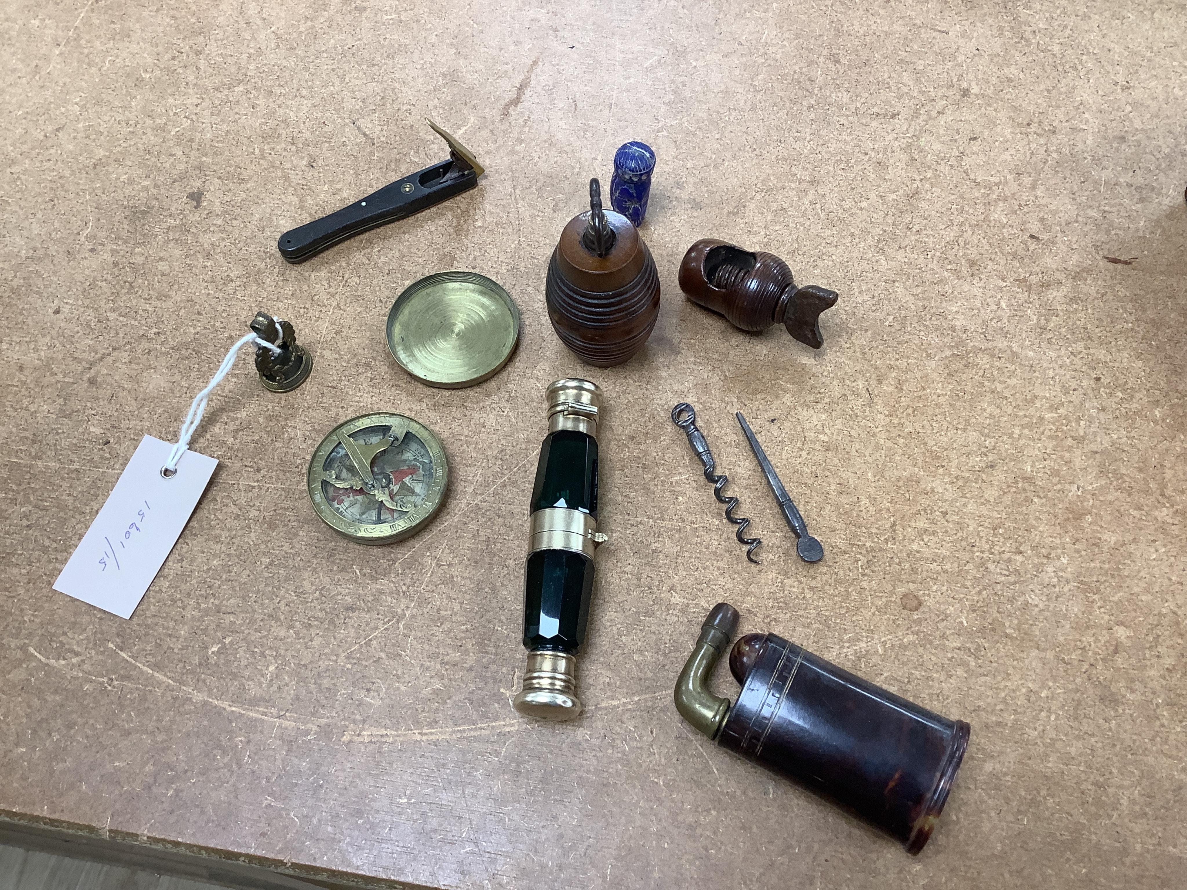 A pocket sundial, a nut cracker, a nutmeg grater, two double ended scent bottles etc., in a leather case, scent bottle 13cm long. Condition - good